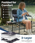 Person sitting on Oversized Camping Directors Chair With Side Table by a lake, showing padding details and comfort features.
