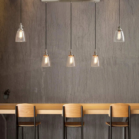 Three Light Industrial Pendant Lighting for Kitchen Island with Oval Clear Glass Shades, Brushed Steel Ceiling Fixture, Retro Modern Vibe Chandelier for Dining Room, Bar, Cafe and Office over wooden countertop