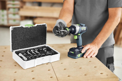 Heavy Duty Forstner Drill Bit Set With Dead On Centering Tips And Razor Sharp Cutting Edges For No Sweat Woodworking Holes In Lumber And Fine Home Cabinetry Projects with drill and case on workbench.