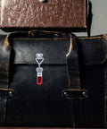 Close-up of leather case with 8 Pack Adjustable Iron Toggle Clamps With Quick Release Pull Latches for Heavy Duty Workholding
