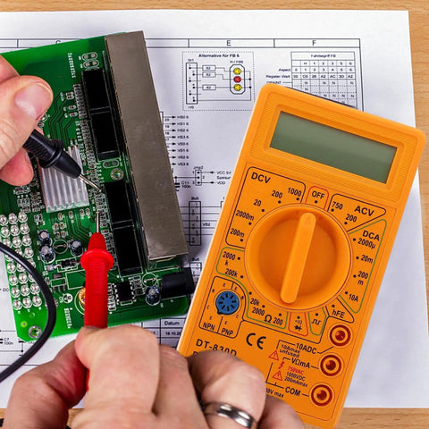 Hands using Digital Multimeter With Buzzer Three And A Half Digit LCD Display Voltage Current And Resistance Tester