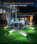 Gathering illuminated by Heavy Duty Solar Spot Lights Outdoor 56 Led With 14 Lenses IP65 Waterproof 3 Modes cool white.