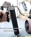 29 Inch Flexible Grease Gun Hose Kit With Spring Shield One Eighth Inch NPT Ends Built Tough High Pressure Extension in use.