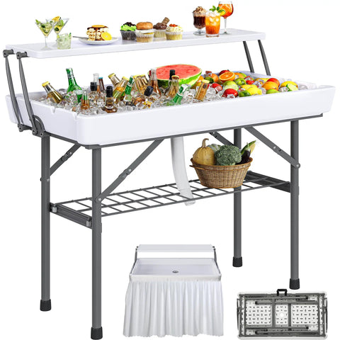 Two Tier Folding Ice Table With Drain And Detachable Skirt, 4 Foot Ice Cooler Table set up with drinks and fruit for events.