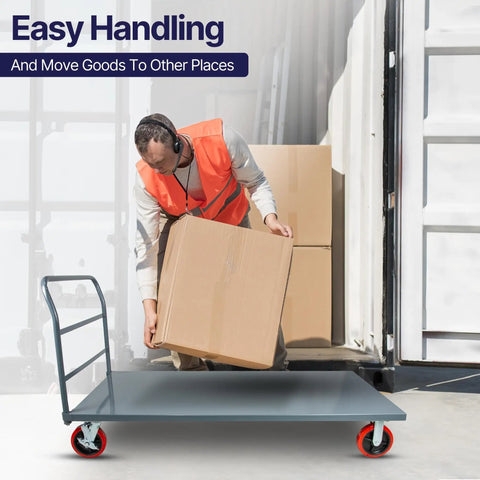 Man loading a box onto a Badass Heavy Duty Flatbed Platform Cart Designed To Crush Retail Loads Featuring A Solid Seventy Two By Thirty Six Inch Deck.
