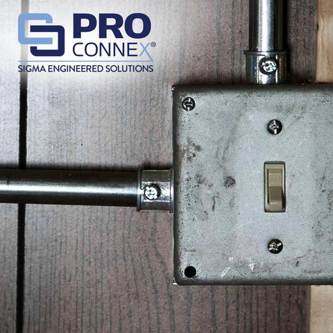 ProConnex TC-501 1/2 Inch EMT Set Screw Connector 50 Pack installed on metal conduit in dry location with outlet box.