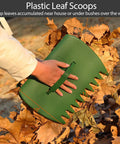 Plastic leaf scoops picking up leaves, part of the Adjustable Leaf Rake With 32 Gallon Yard Waste Bag And Leaf Scoops kit.