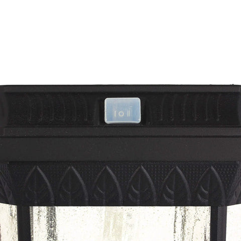 Top view of Dope Solar Post Light in black cast aluminum with seeded glass, showing close-up of the switch and decorative details.