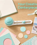 Adjustable Circle Cutter For Crafts And Scrapbooking on a desk with colored paper circles and a notebook.