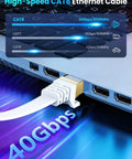 Ultra Fast Cat8 Ethernet Cable 3ft Flat Shielded STP RJ45 For Router Modem Gaming And 4K And 8K Streaming, 40Gbps, Up To 2000MHz, Lag Free, Under Carpet Friendly, White connected to a laptop.