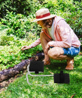 Woman gardening with Garden Kneeler Seat With Thick Foam Padding And Wearable Knee Support in backyard setting