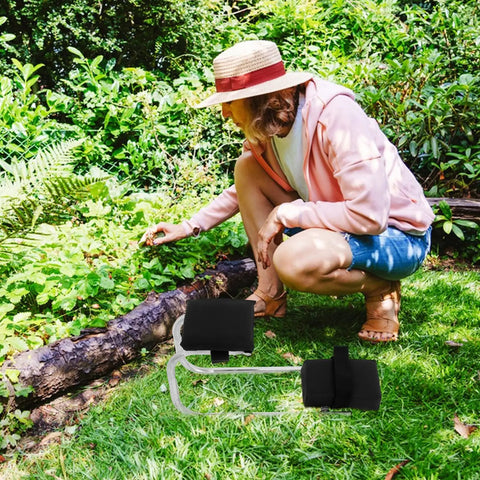 Woman using Garden Kneeler And Seat Portable With Thickened Foam Pad for outdoor gardening, wearing a sun hat and kneeling on grass.