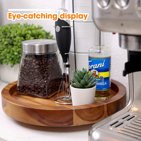 Slick 13 Inch Acacia Wood Lazy Susan Turntable Organizer For Kitchen Cabinets with coffee jar and plant on countertop.