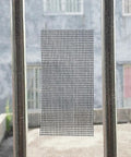 Heavy Duty Window Screen Repair Tape And Mesh Patch Kit 2 Inches By 16 Feet Long Black adhesive mesh patch on window.