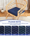 Outdoor Chair Cushions Set Of 4 Waterproof 19X19X3 Inches With Handles And Ties Navy Blue displayed on a wicker chair indoors.