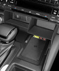 Interior view showing Toyota Land Cruiser Prado 250 center console with organizer tray for 2024-2026 models, tidy storage.