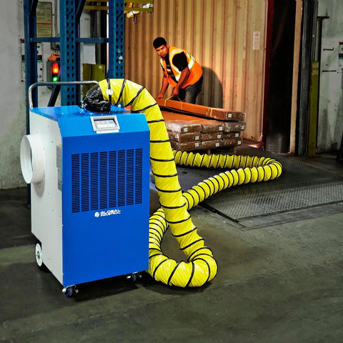 Heavy Duty Outdoor Portable Air Conditioner With 13700 Btu Cooling Capacity For Up To 315 Square Feet in use with duct kit in a warehouse.