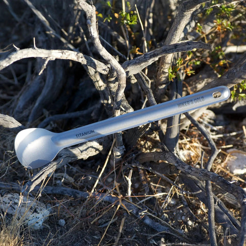 Ultralight Titanium Camping Spoon For Backpacking And Hiking, 16g Silver Utensil With 8.5 Inch Reach against dry branches