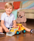 Child playing with Colorful Kids Construction Bulldozer Toy With Movable Loader And Friendly Driver Durable Yellow Front End Loader Truck For Toddlers Soft Rubber Wheels Kid Friendly Classic Style For Sandbox Play Ages 18 Months And Up on wooden floor