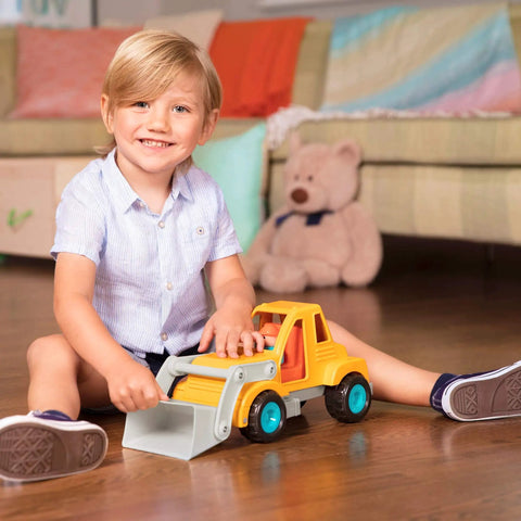 Child playing with Colorful Kids Construction Bulldozer Toy With Movable Loader And Friendly Driver Durable Yellow Front End Loader Truck For Toddlers Soft Rubber Wheels Kid Friendly Classic Style For Sandbox Play Ages 18 Months And Up on wooden floor