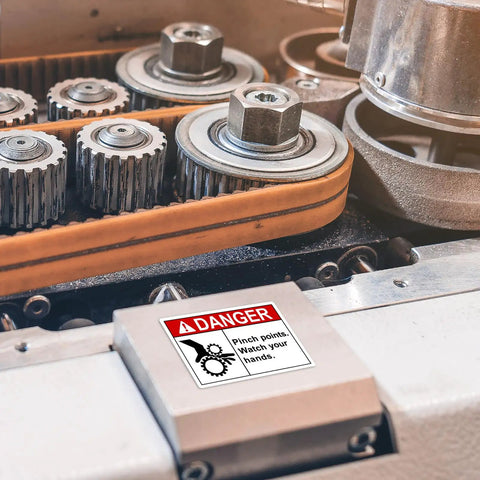 Pinch Point Danger Labels 50 Pcs, 5 X 3.5 Inch Durable PET Vinyl Safety Stickers installed on machinery in workplace