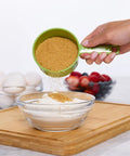 Using Must Have Nestable Measuring Cup Set With Two Tablespoons Coffee Scoop, Durable BPA Free Plastic for adding sugar to bowl