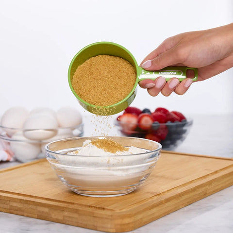 Using Must Have Nestable Measuring Cup Set With Two Tablespoons Coffee Scoop, Durable BPA Free Plastic for adding sugar to bowl