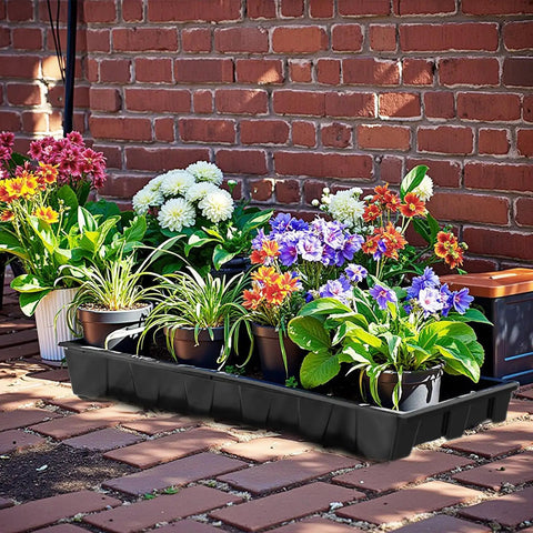 Ten Pack No Drain Holes Seed Starter Trays Made From Durable Reusable Plastic with potted plants in outdoor setting