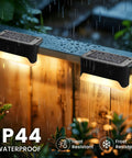 Real Deal Solar Deck Lights For Outdoor Yard And Fence Featuring Waterproof 16 Pack Warm White 4 Led Bulbs Per Unit With Wide Coverage And No Sweat Setup For Total Backyard Chill Atmosphere on fence under rain.