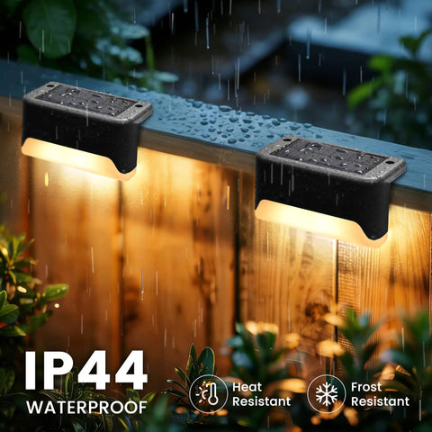 Real Deal Solar Deck Lights For Outdoor Yard And Fence Featuring Waterproof 16 Pack Warm White 4 Led Bulbs Per Unit With Wide Coverage And No Sweat Setup For Total Backyard Chill Atmosphere on fence under rain.