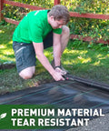 Person installing Heavy Duty Weed Barrier Fabric 3 Ft By 50 Ft Woven Landscape Ground Cover Mat for gardening