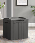 31 Gallon Weatherproof Resin Deck Box With Lid For Indoor Outdoor Storage Durable Grey Outdoor Storage Container For Patio Furniture Cushions Garden Tools And More Doubles As A Seat Or Side Table shown in a living room setting.