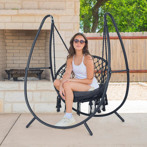 Woman relaxing on Ultimate Outdoor Hammock Swing With Stand For Your Patio Or Backyard, Hanging Chair With Removable Seat Cushion