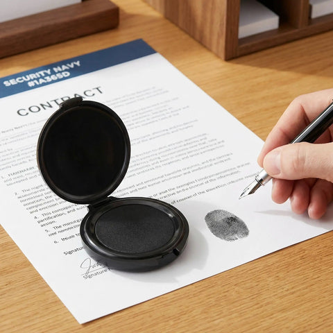 Straight Up Slick Mini Finger Print Ink Pads Set Of Two Quick Drying Black Stamp Supplies featuring a black ink pad on a contract.