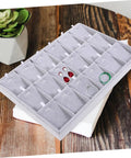 Lowkey Perfect Multi Grid Jewelry Tray For Rings And Necklaces With Smart Dividers, dark gray organizer showcasing earrings and rings.