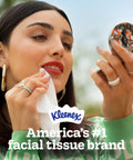 Woman wiping face with tissue, showcasing Snap And Go Ultra Soft Facial Tissues Travel Size Four On The Go Packs With Twenty Five Tissues.