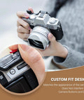 Person holding camera with XT30III Pro Thumb Grip With Shutter Button For XT30II XT20 XT10 Mirrorless Cameras, close-up view.