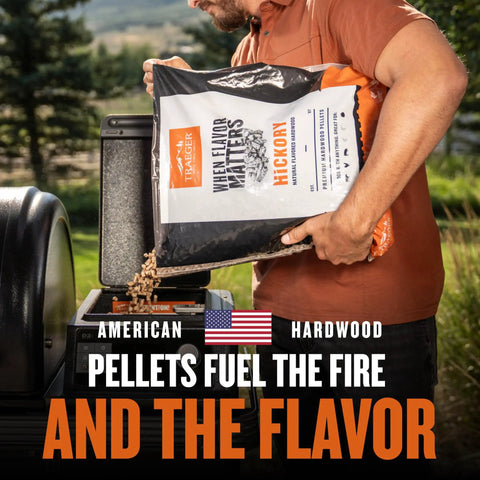 Man pouring wood pellets into Woodridge Pro Electric Wood Pellet Grill And Smoker For Backyard Grillin With 970 Sq In Cooking Area