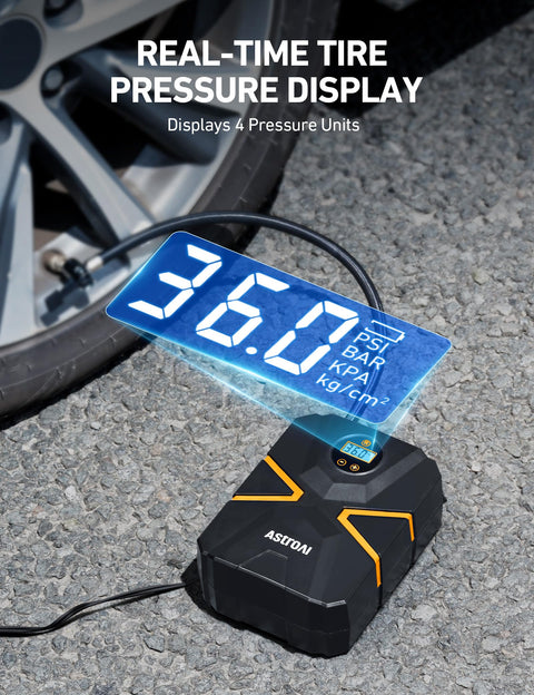 Portable 12V Digital Tire Inflator With Auto Shutoff, Real Time Pressure Display next to car tire on asphalt