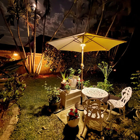 Warm White Cordless Umbrella Light With 3 Brightness Modes, 28 LEDs Up To 200 Lumens, illuminating patio at night