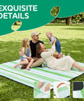 Family on XL Waterproof Beach Blanket For Picnics And Camping, green striped design, relaxing outdoors in a park