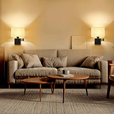 Cozy 9.5 Inch Wall Lamp With USB Port Dimmer Swing Arm Plug In Cord Beige Fabric Shade Ideal For Bedroom Living Room Office Hallway Warm Glow And Modern Convenience illuminating living room with beige sofa and wooden table.