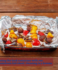 Heavy Duty Aluminum Foil Sheets 500 Pop Up Interfolded 12 By 12 Inch Sheets used in baking dish containing roasted vegetables