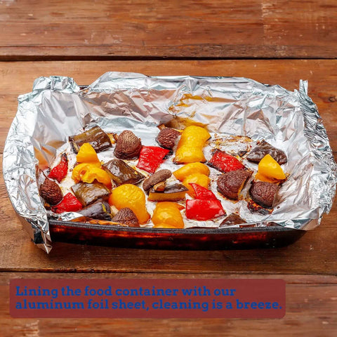 Heavy Duty Aluminum Foil Sheets 500 Pop Up Interfolded 12 By 12 Inch Sheets used in baking dish containing roasted vegetables
