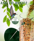 Close-up of Six Port Metal Bird Feeder For Outdoors Real Sturdy Tube Style Design with seeds being poured in