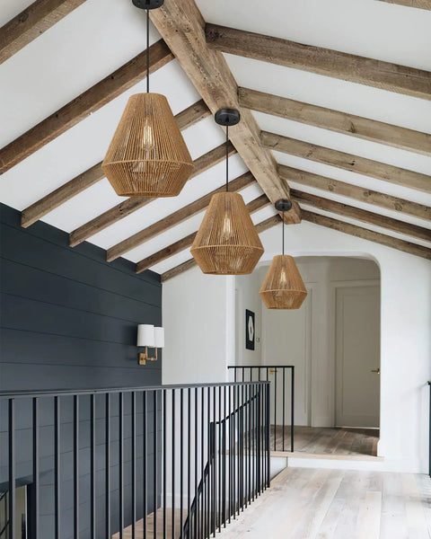 12 Inch Handwoven Rattan Pendant Light with Rustic Boho Vibe hanging in a hallway, modern minimalist ceiling fixture