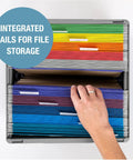 Top view of hand organizing files in a Neptune Blue Collapsible Milk Crate 3 Pack 25L Each, showing rainbow-colored folders.