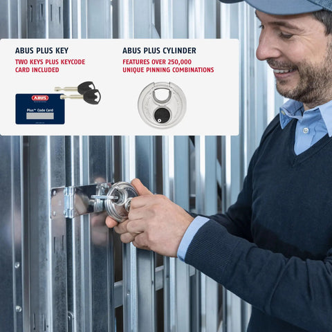 Person securing a gate with a heavy duty Diskus storage padlock, 3.16 inch wide shackle lock, weather resistant, for outdoor use