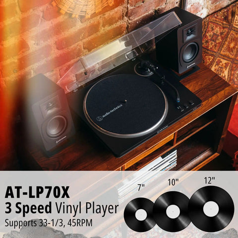 Fully Automatic Belt Drive Turntable Bundle With SAM30 3 Inch Powered Studio Monitors on wooden shelf with records