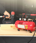 18 Gauge Brad Nailer and Quiet 1 Gallon Air Compressor Combo Kit for Finish and Trim Projects, shown on a workbench